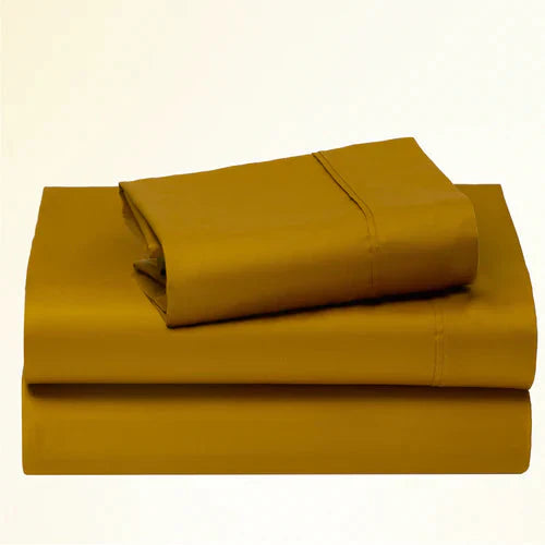 "CinchFit King Sheet Set in mustard yellow, 400TC cotton. Bold color and deep pocket design for snug mattress fit."