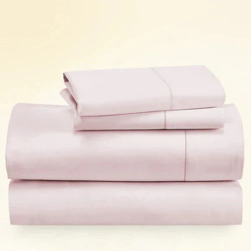 "CinchFit King Sheet Set in blush pink, 400TC cotton. Soft, elegant bedding with deep pockets and secure fit."