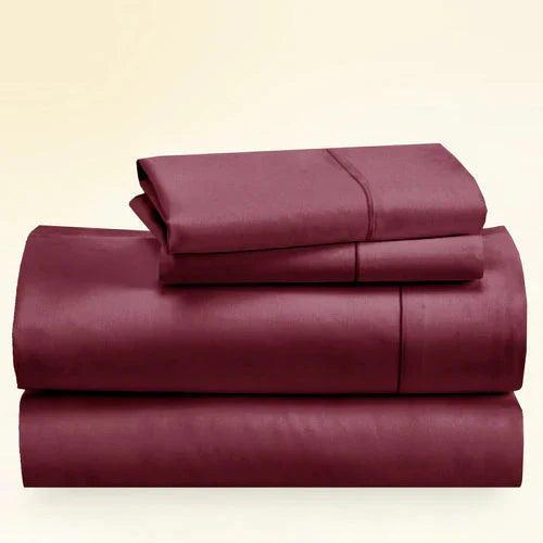 "CinchFit King Sheet Set in burgundy, 400TC cotton with 15-inch depth. Rich color and secure fit for luxury bedding."